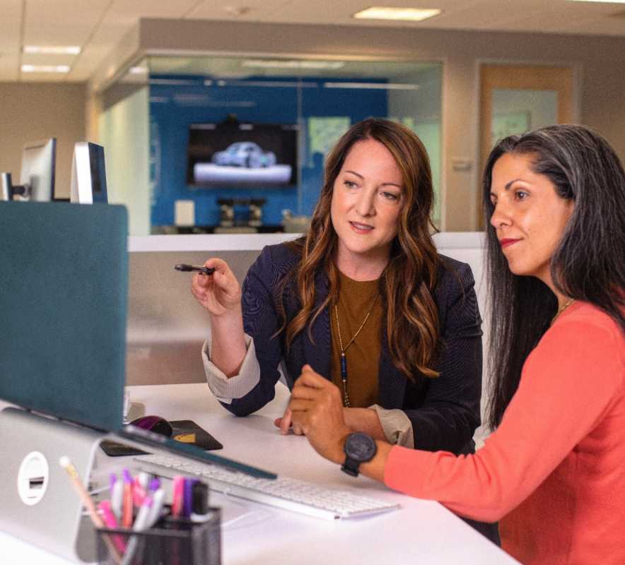 Women at a Table Reviewing Talent